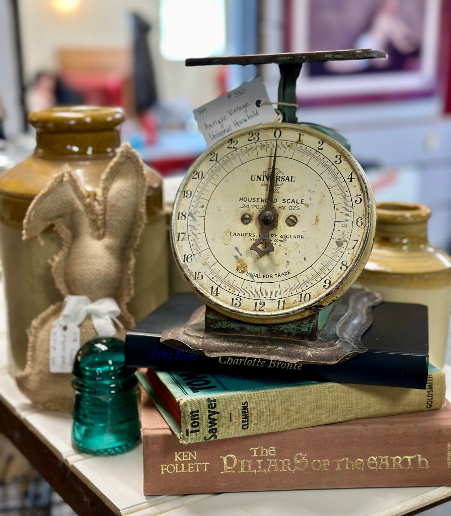 antique scale and vintage books